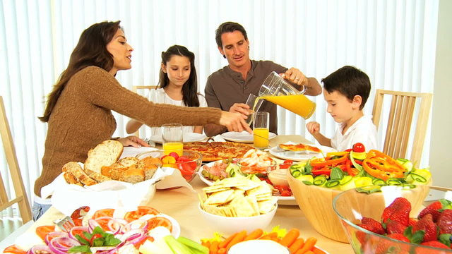 Young Family Enjoying  Healthy Lifestyle Food