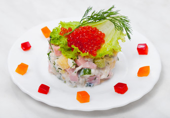 Salad of vegetables with red caviar