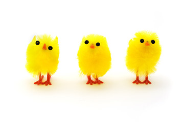 Three yellow easter chicks in a row