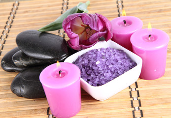 Fototapeta na wymiar Lavender spa salt, spa stones,candles and a tulip flower
