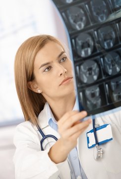 Attractive radiologist analysing x-ray image