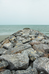 Fototapeta na wymiar Stone pathway, A pathway to the sea made from big rocks.