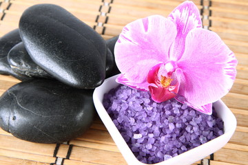 Lavender spa salt, spa stones and an orchid flower