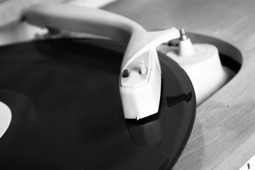 Turntable and vinyl record in close up © teine