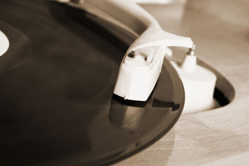 Turntable and vinyl record in close up © teine