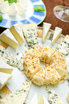 Few types of cheeses on the plates