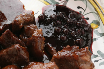 Estofado con salsa di arándanos