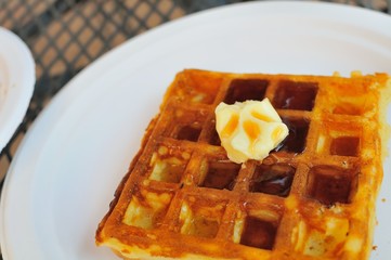 Waffle with butter and syrup