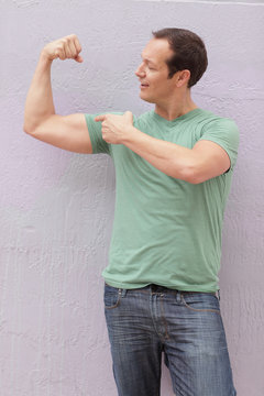 Man flexing his arm muscle
