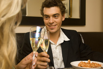 Couple celebrating a meal with his girlfriend
