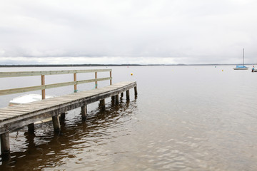 Fototapeta premium View of a wooden pontoon on a lake