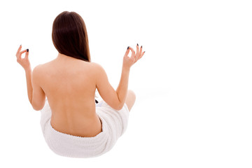 Obraz premium Lovely young nude woman with towel sit of back