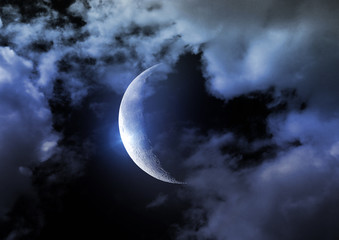 Half of moon in the night black sky