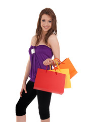 Smiling girl with colorful shopping bags