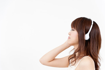 beautiful asian woman listening music
