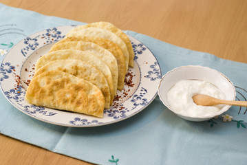 The Tatar meal, pies fried with forcemeat yogurt.