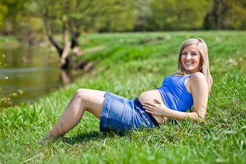 Fototapeta premium Pregnant woman outdoor spring time