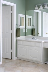 Bathroom with white cabinets and trim