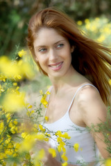 Portrait of beautiful woman in brooms field