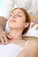 Fototapeta na wymiar Beautiful woman having a head massage