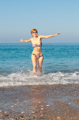 woman in swimwear on the beach .