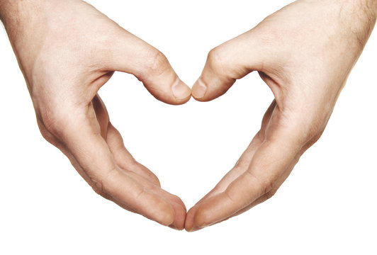 Human hands forming a heart over white background