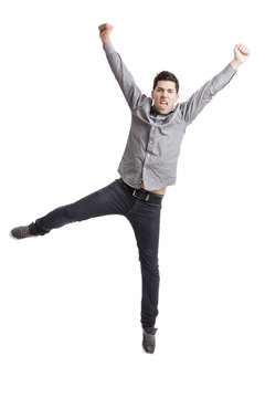 Happy Young Man With Arms Up Isolated On A White Background