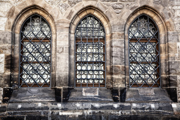 Old style windows on historic stone building