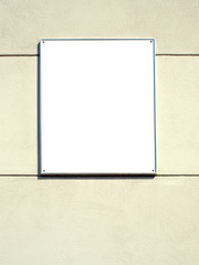 White plate in a metal frame