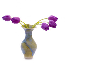 Colorful purple tulips in a beautiful vase. Copy Space on right