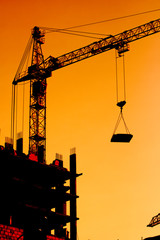 Construction crane at sunset