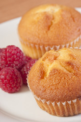 golden muffins with raspberries