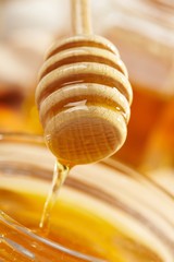 Honey with wood stick