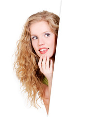 Woman looking from behind a blank space