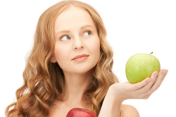 young beautiful woman with green and red apples