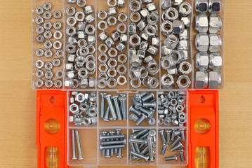 Set of Bolt Heads and Screws with Buble Levels on Table