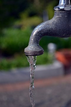 Running water from a garden faucet tap