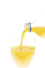 Orange juice poured into a glass/Pouring fresh cold juice