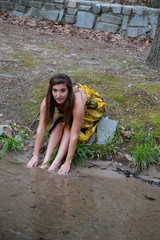 Obraz premium Lovely woman in a stream outside