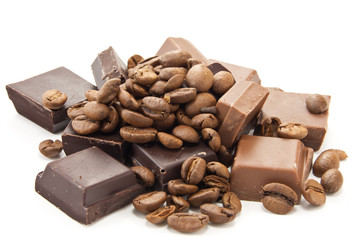 Heap of coffe beans and chocolate on white