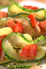 Sauteed zucchini slices, tomato cubes, onion and cooked corn