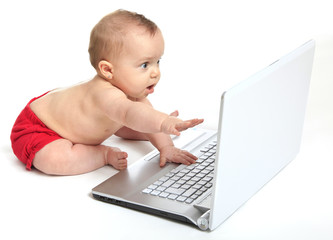 Baby girl playing the computer