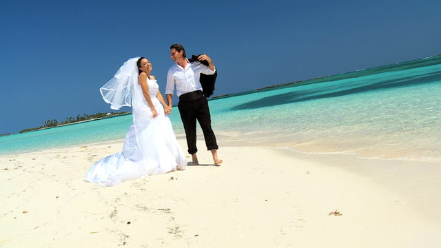 Couple on Paradise Island Beach After Dream Wedding