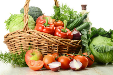 Composition with variety o fresh vegetables in wicker basket
