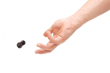 hand throwing two dices isolated on white background