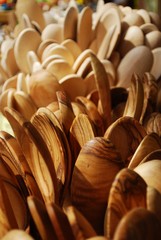 Group of wooden cooking spoons on sale at market