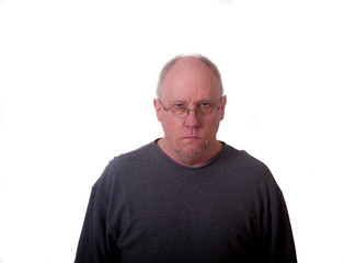 Older Bald Man in Grey Shirt Looking Mean