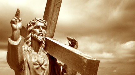 jesus holding a cross