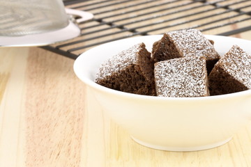 chocolate brownies with powdered sugar on top