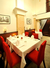 Tables set for meal in modern restaurant